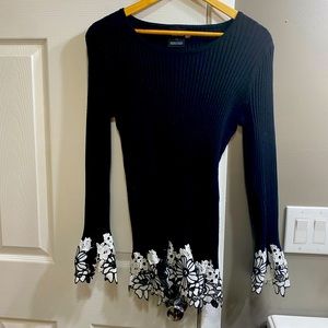 Black sweater with lace cuffs and bottom edging
